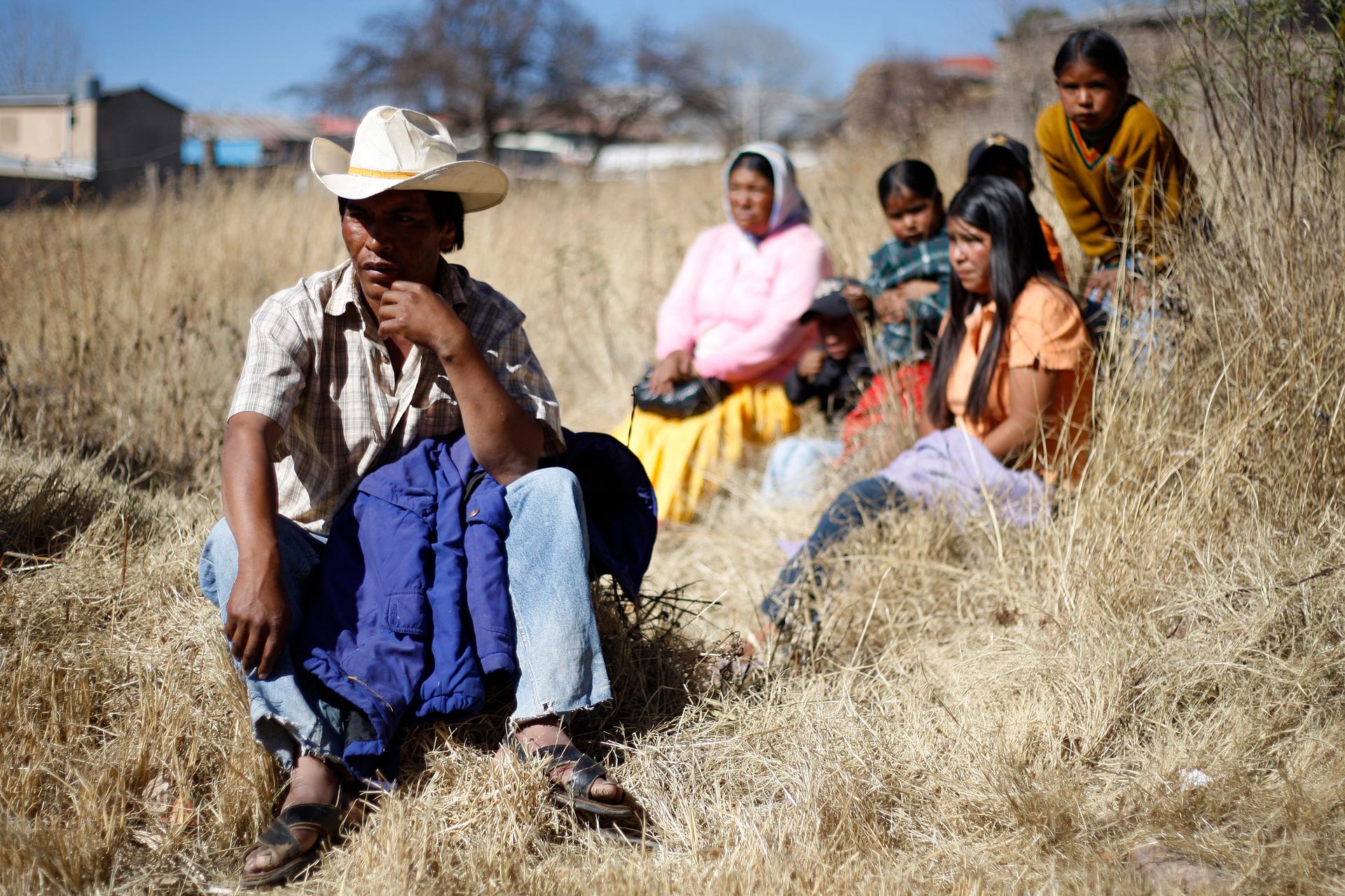 Tarahumara Indigenous family sits together in Guachochi November 30, 2011.