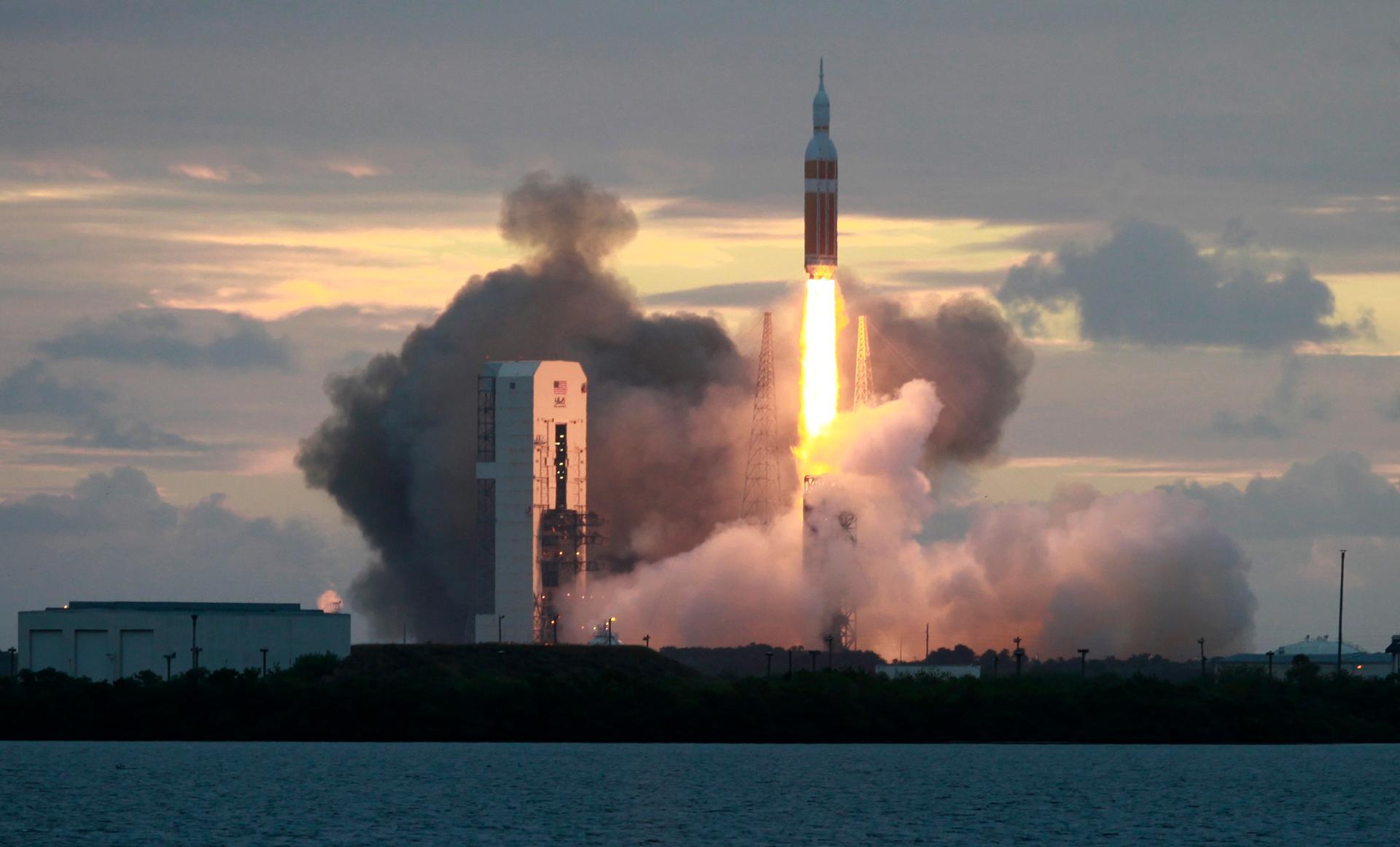 The Delta IV Heavy rocket with the Orion spacecraft lifts off from the Cape Canaveral Air Force Station on December 5, 2014.