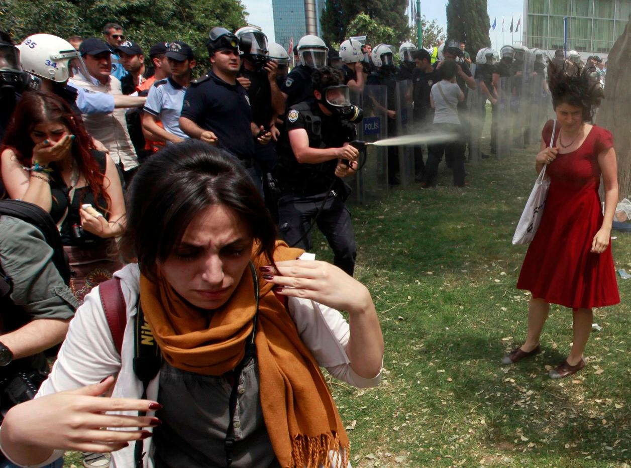 A Turkish riot policeman sprays tear gas in what became an iconic image during the Gezi Park protests on May 28, 2013.