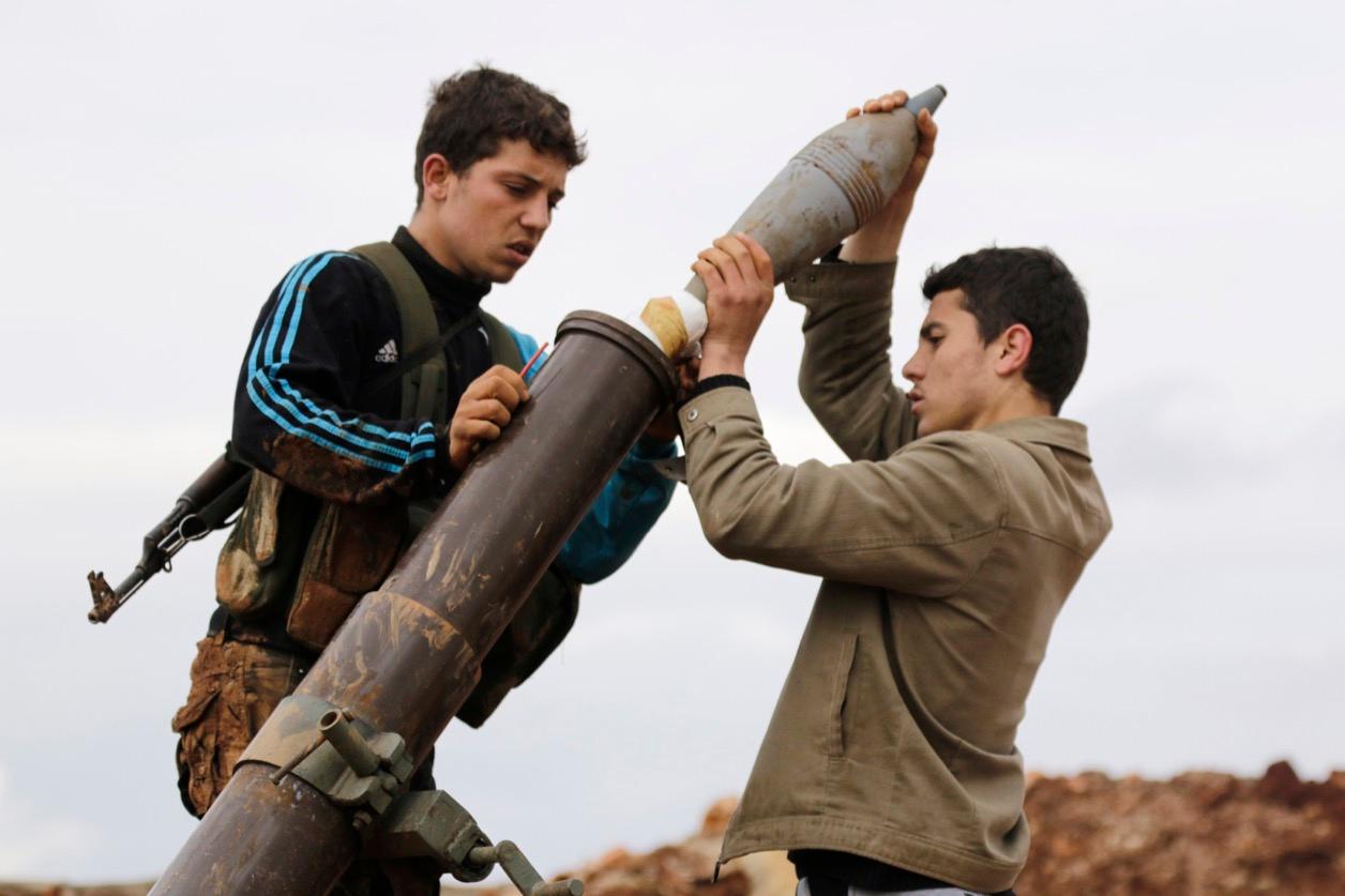 Nusra fighters prepare to fire a mortar toward Assad forces in al-Mallah farms, north of Aleppo, on Feb. 18, 2015.
