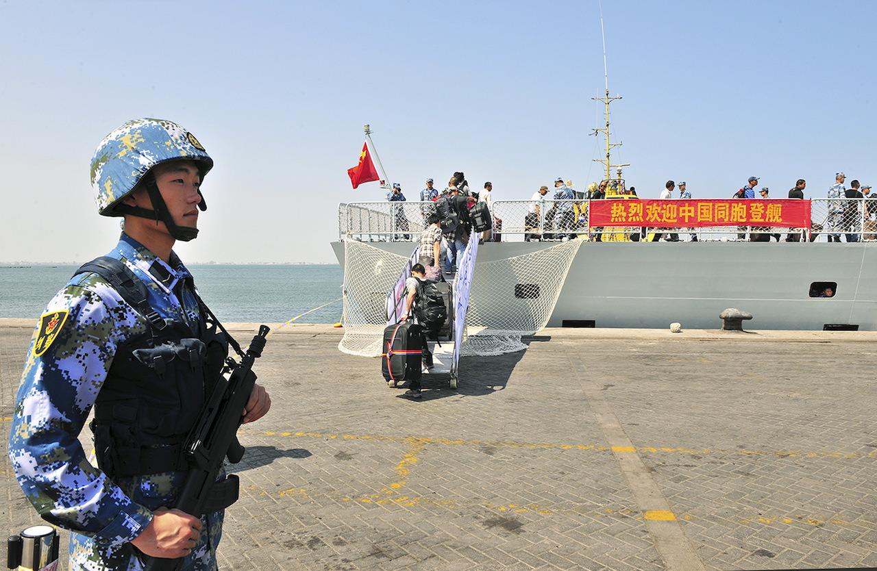 Chinese citizens board the naval ship 