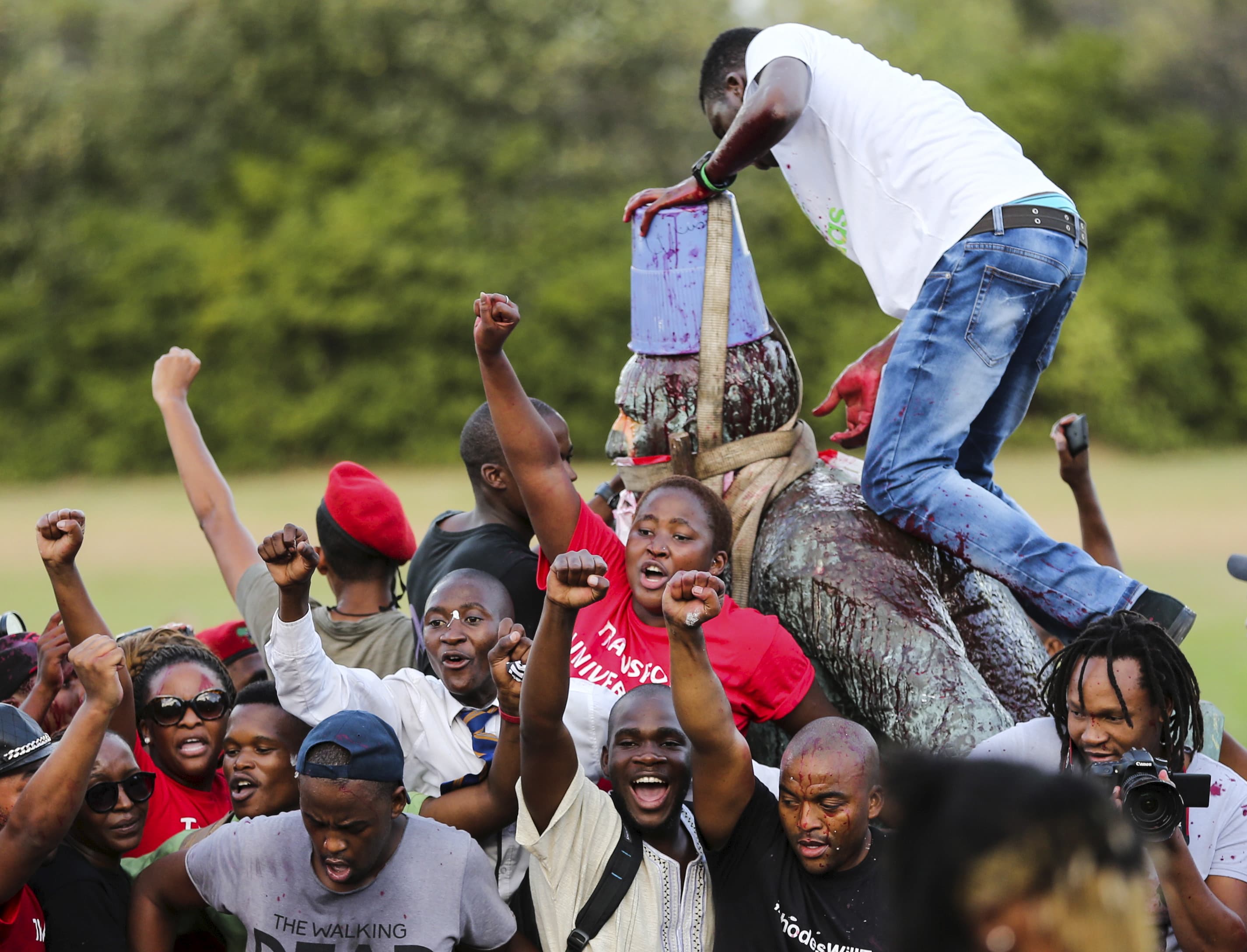 Students cheer as the statue of Cecil John Rhodes is removed from the University of Cape Town (UCT), April 9, 2015.