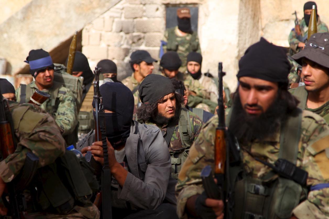 Members of al-Qaeda's Nusra Front gather before moving toward their positions during an offensive to take control of the northwestern Syrian city of Ariha, Idlib province, from forces loyal to President Bashar al-Assad, on May 28, 2015.