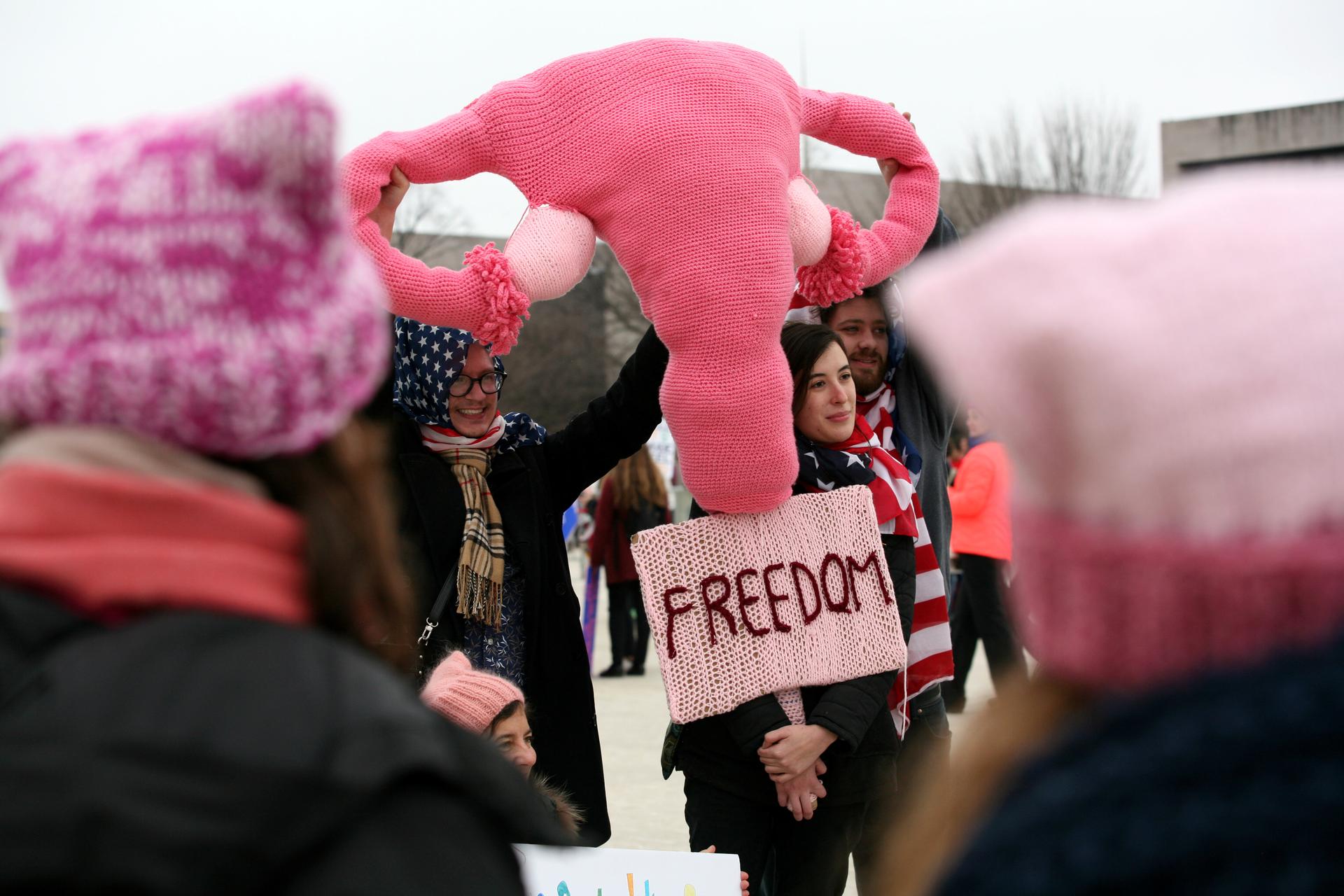 People display a knitted replica of the female reproductive system at the Women's March, held in opposition to the agenda and rhetoric of President Donald Trump in Washington, DC, January 21, 2017.