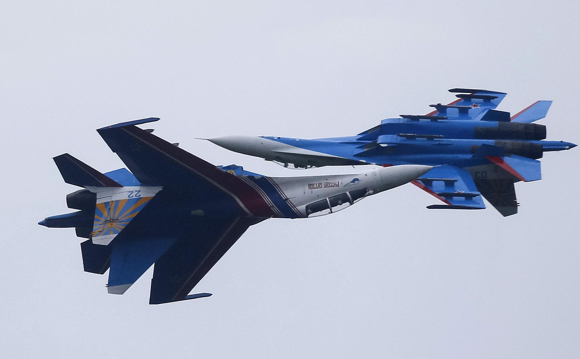 Sukhoi Su-27 Flanker fighters of the Russkiye Vityazi (Russian Knights) aerobatic show team are seen performing in 2015. Finland says Russian jets like these have probed its airspace.