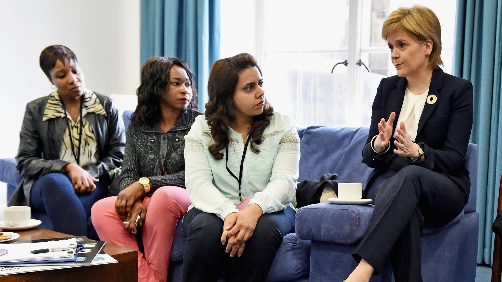 Nicola Sturgeon, Scotland's First Minister, meets with a representative from a refugee community.