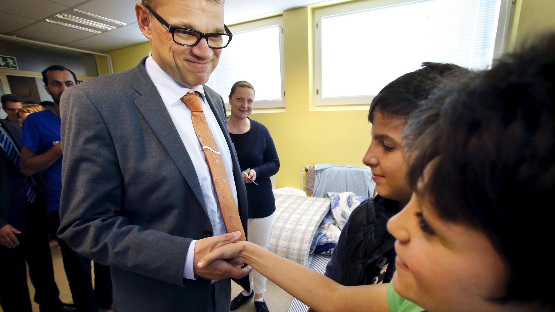 Finland's Prime Minister Juha Sipila visits a refugee reception center in Northern Finland.