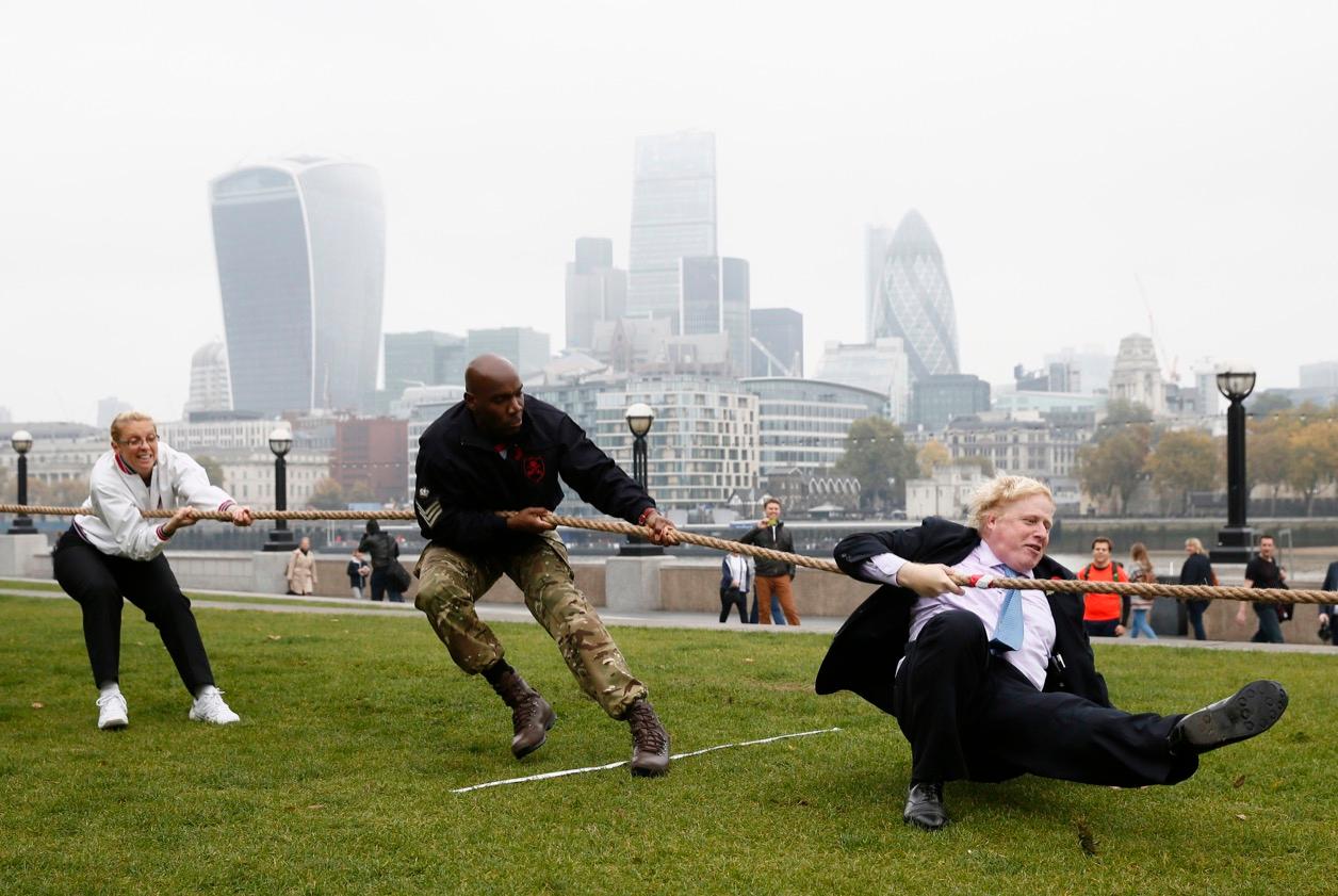 Then-Mayor Boris Johnson took part in a tug of war with members of the armed services to launch the London Poppy Day, outside City Hall, in London, on Oct. 27.