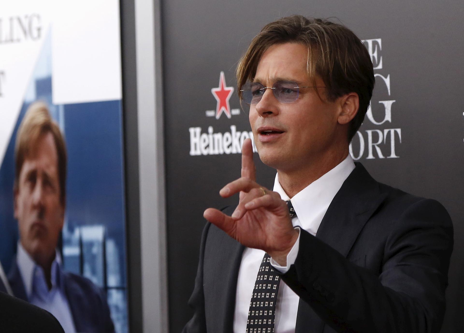 Cast member Brad Pitt gestures on the red carpet at the premiere of 