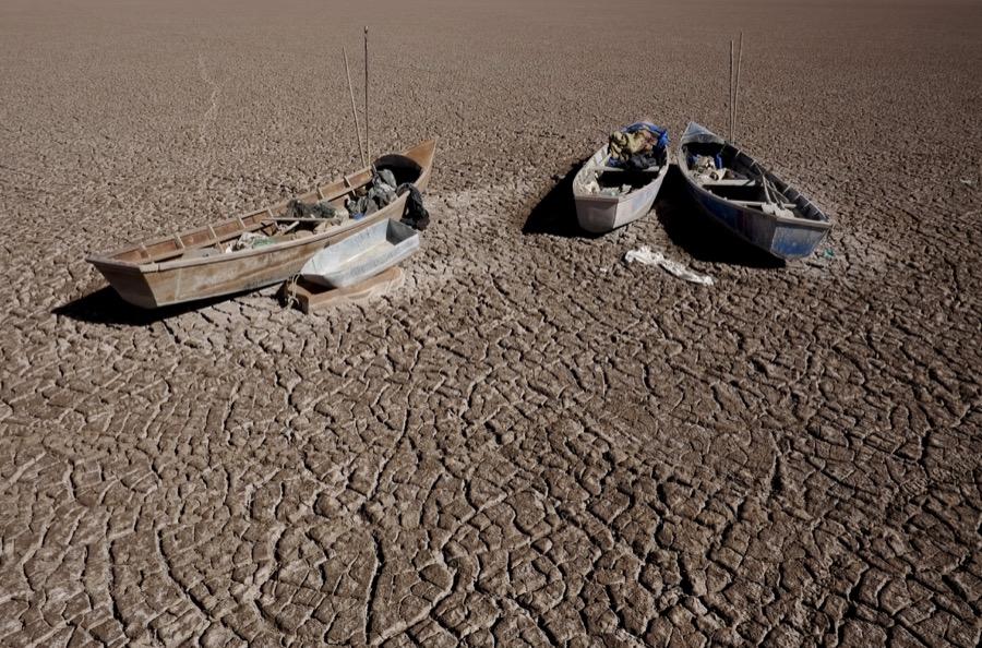 Fishing boats on the dried Poopó lakebed in the Oruro Department, south of La Paz, Bolivia, on Dec. 17, 2015.