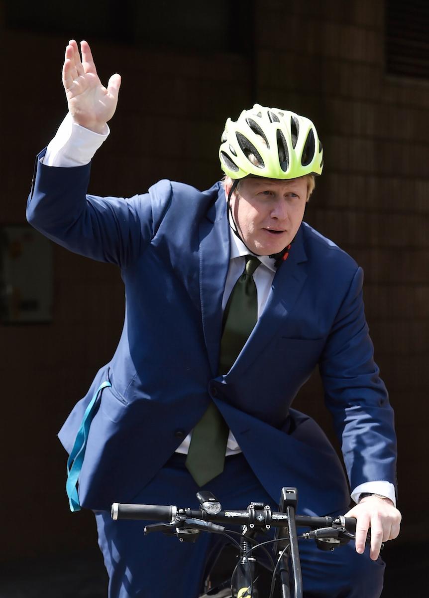 Boris Johnson bikes off after his speech at a Vote Leave rally in London on May 9.