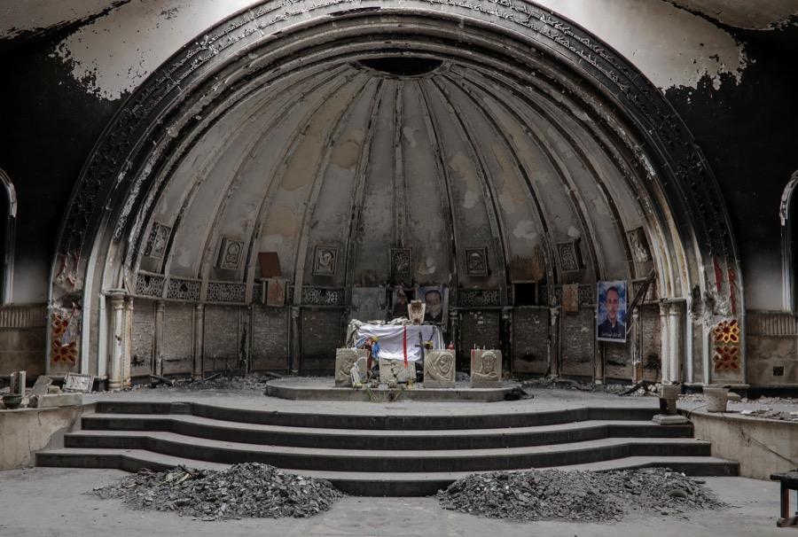 An altar of a damaged church is seen in the town of Qaraqosh, south of Mosul, Iraq, April 11.
