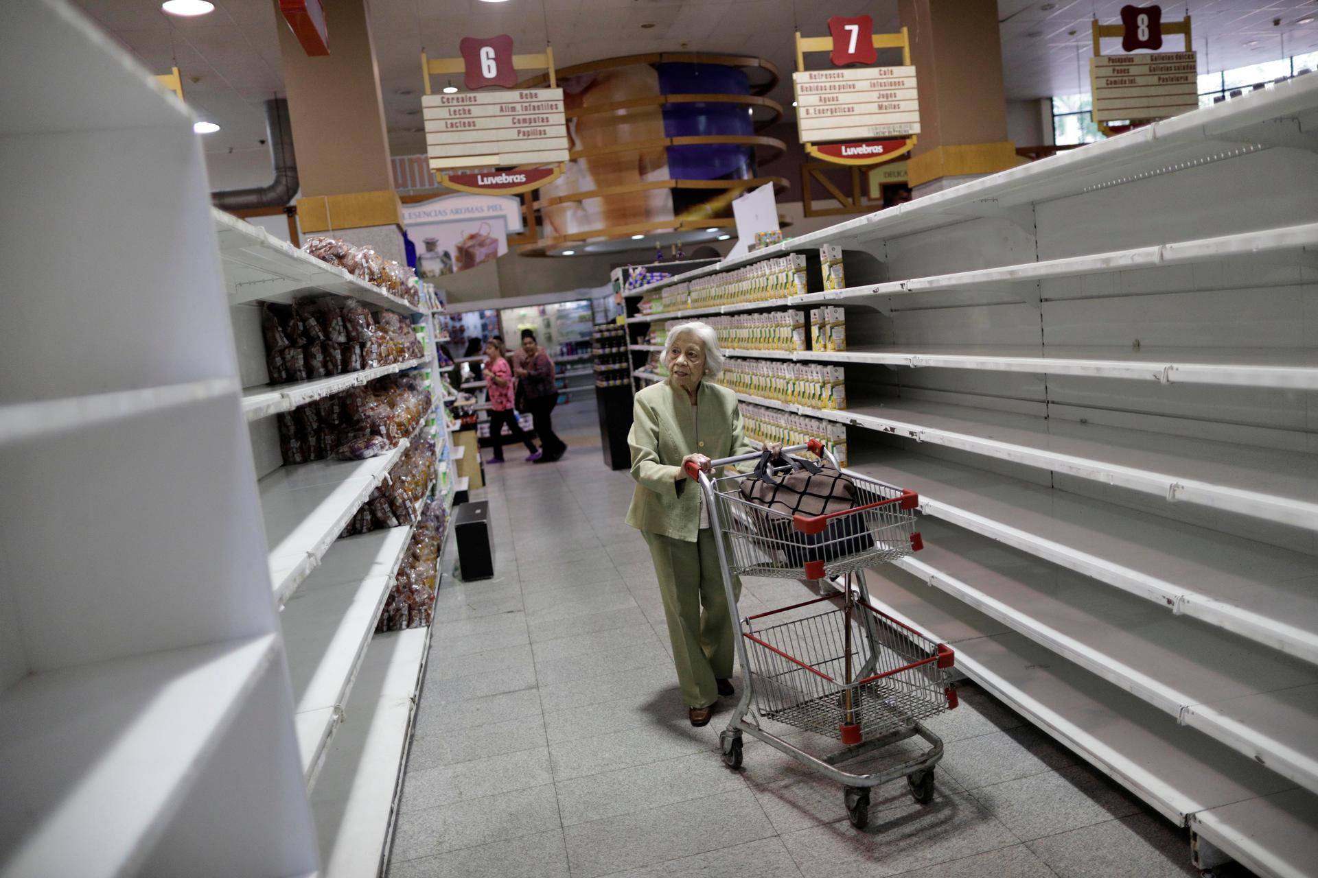 Amid a food shortage, people shop inside a supermarket in Caracas, Venezuela, July 25, 2017.