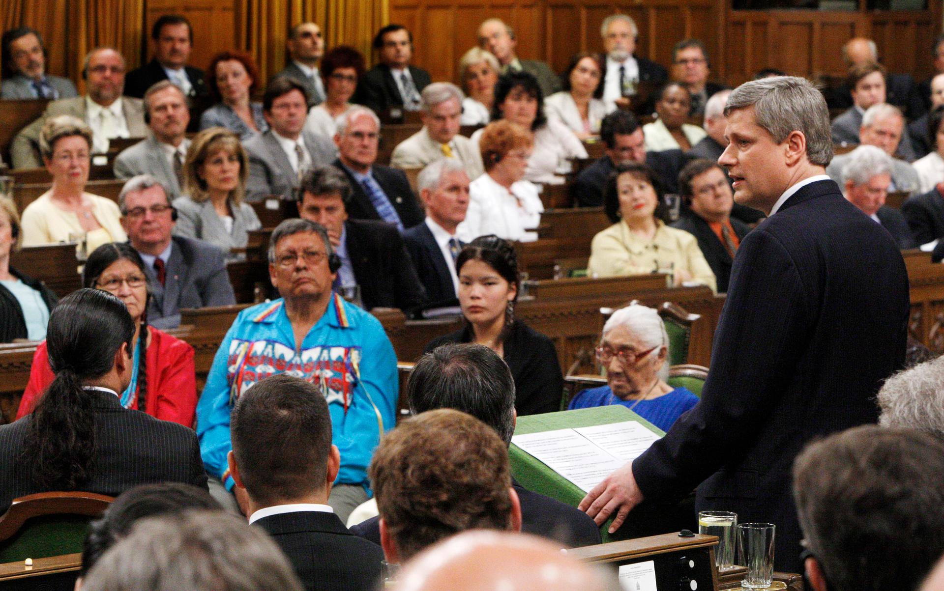 Canada's Prime Minister Stephen Harper issues an apology in the House of Commons on Parliament Hill in Ottawa June 11, 2008.
