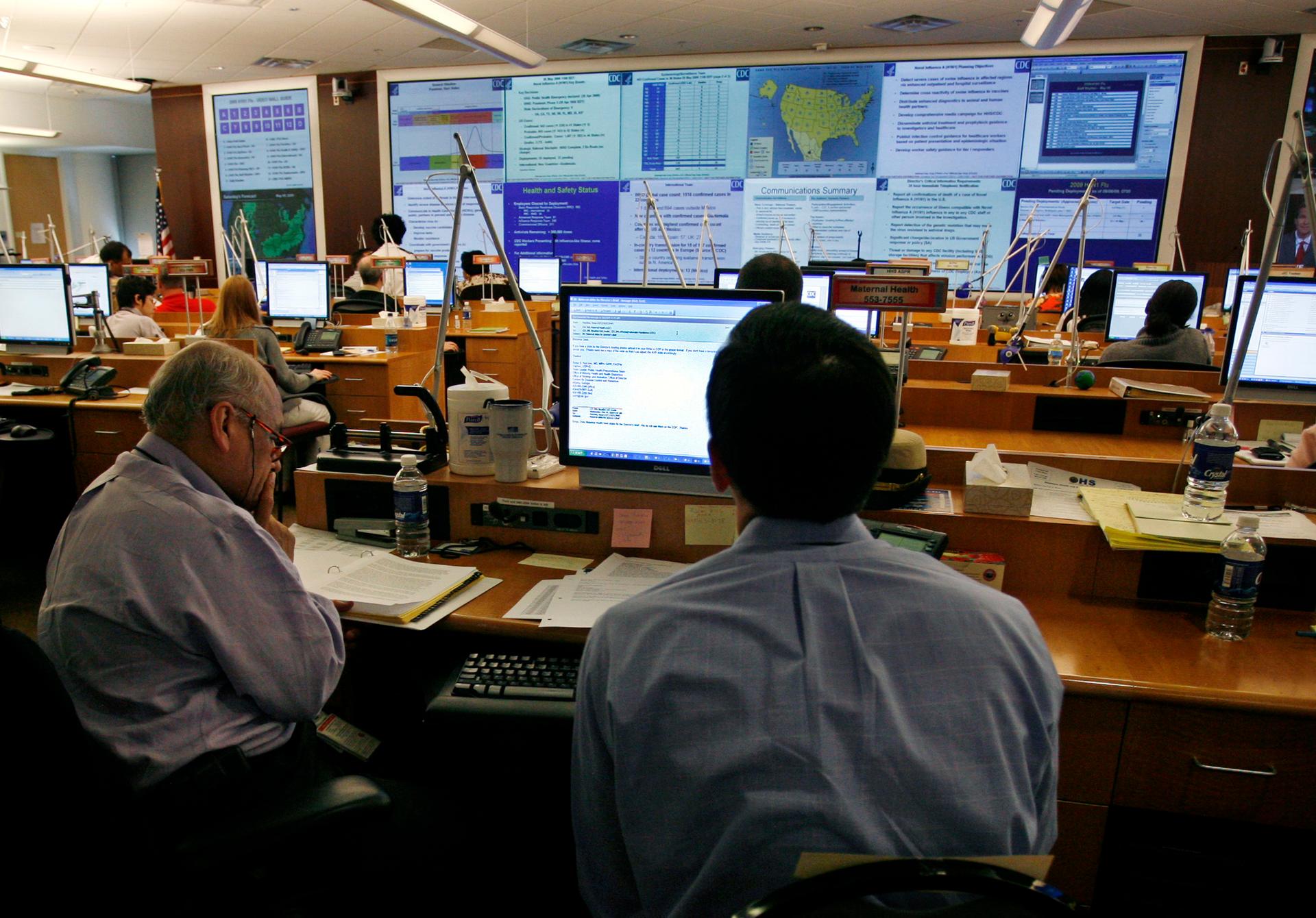 Centers for Disease Control workers monitor the H1N1 flu virus outbreak from the CDC Emergency Operations Center in Atlanta, Georgia May 6, 2009.