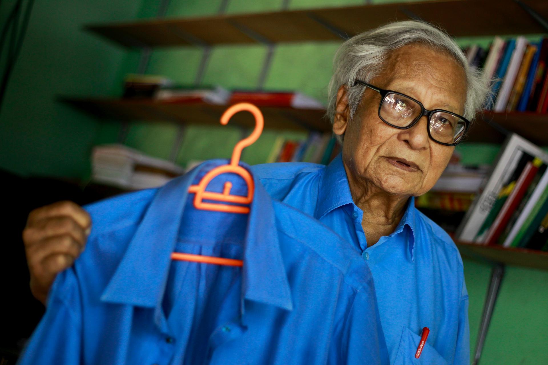 Win Tin with his prison-issued work shirts in 2013