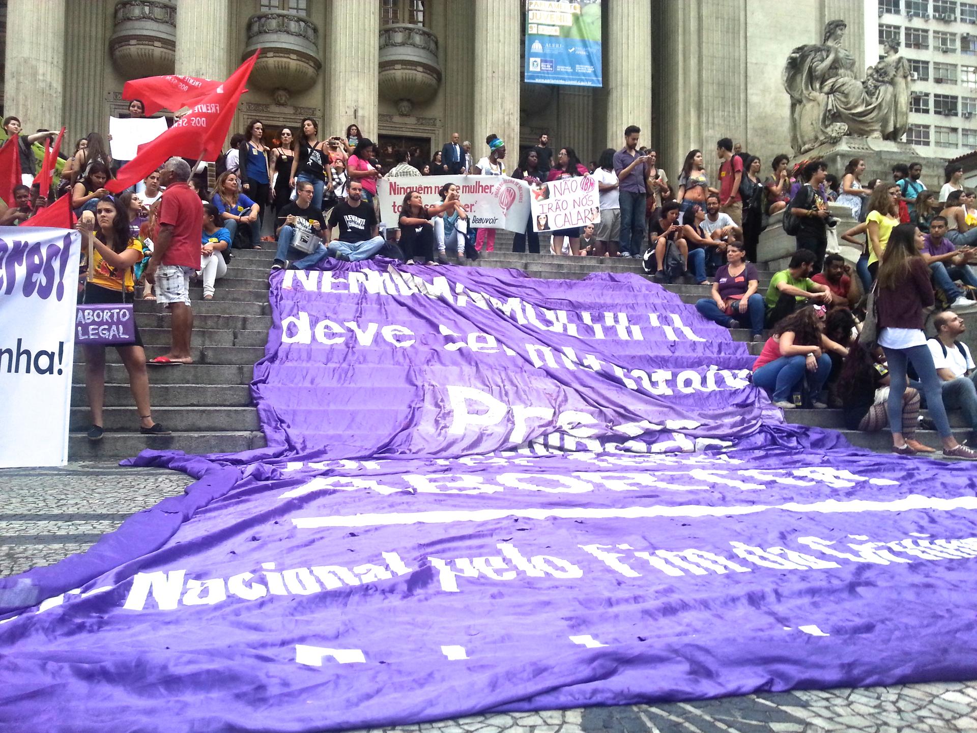 A banner draping the front steps of Rio's state legislature reads 