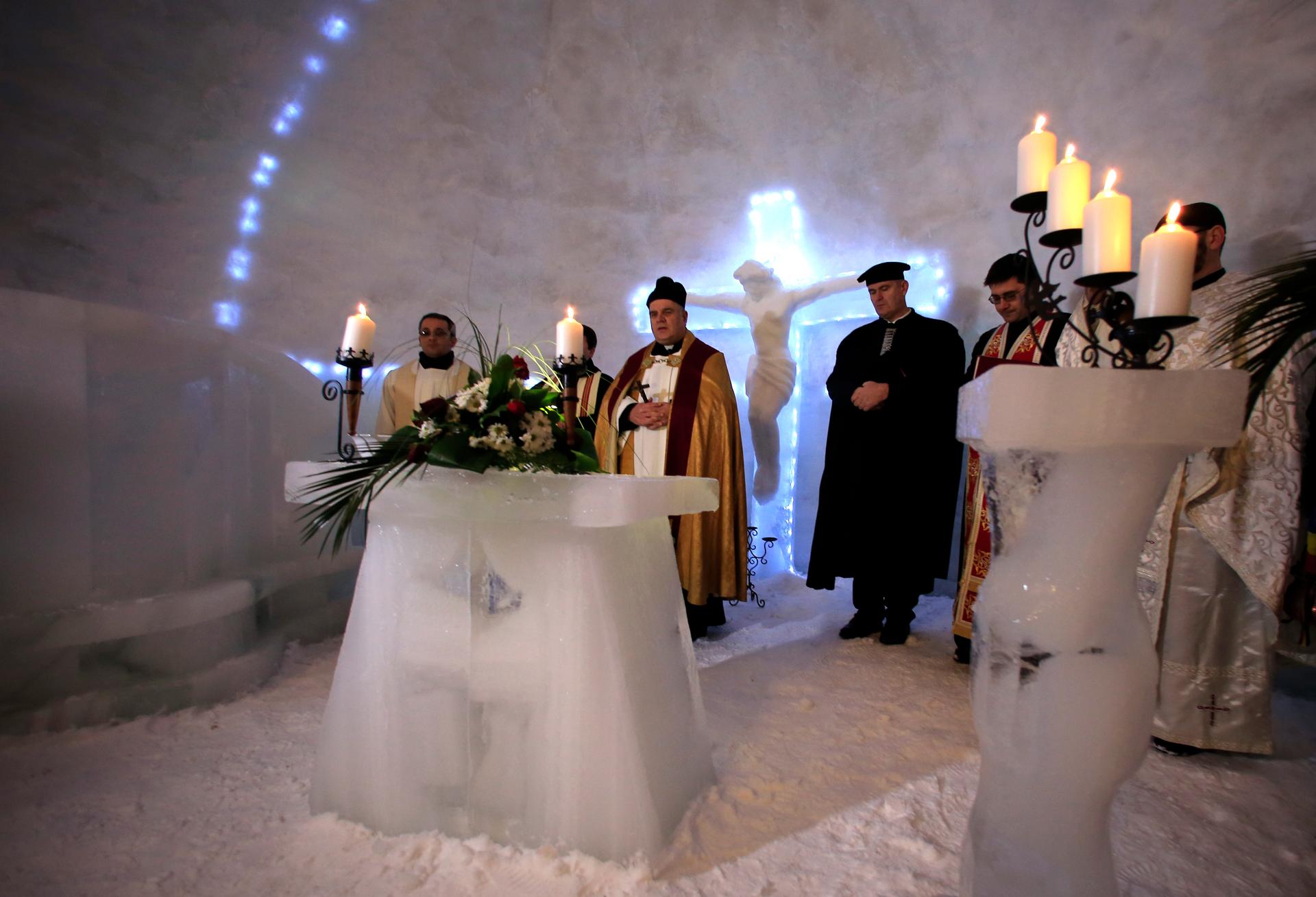 A group of priests of various congregations hold an inaugural mass for a church made entirely from ice at Balea Lac resort.