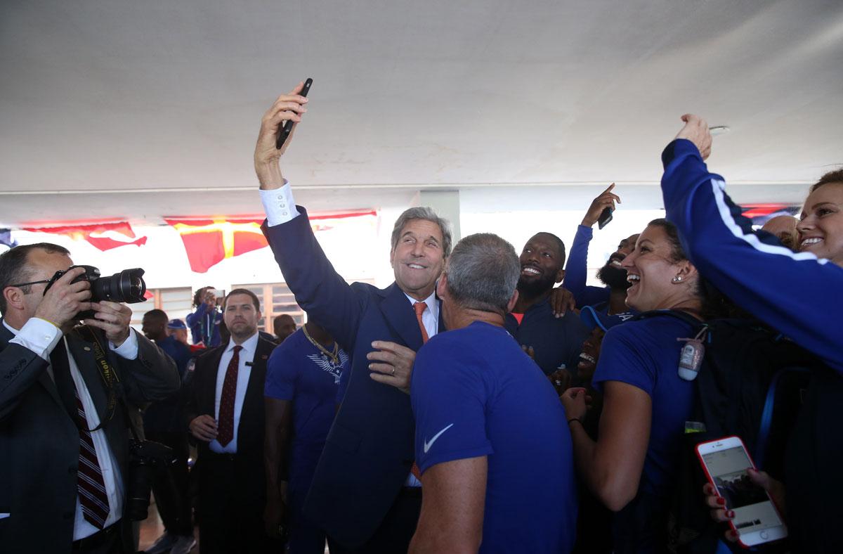 US Secretary of State John Kerry takes a selfie with members of the US Olympic team at the Brazilian Naval Academy.