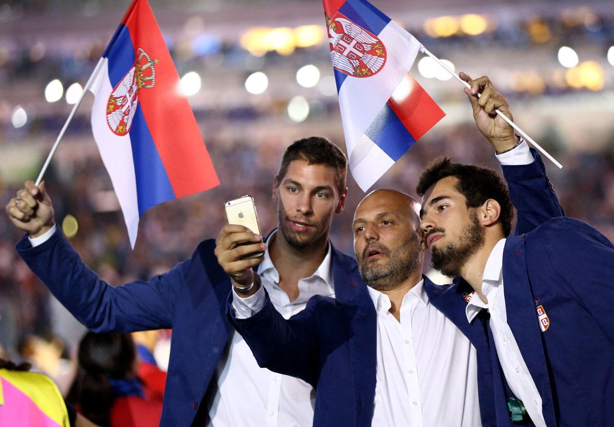 Athletes from Serbia take a selfie during the opening ceremony.