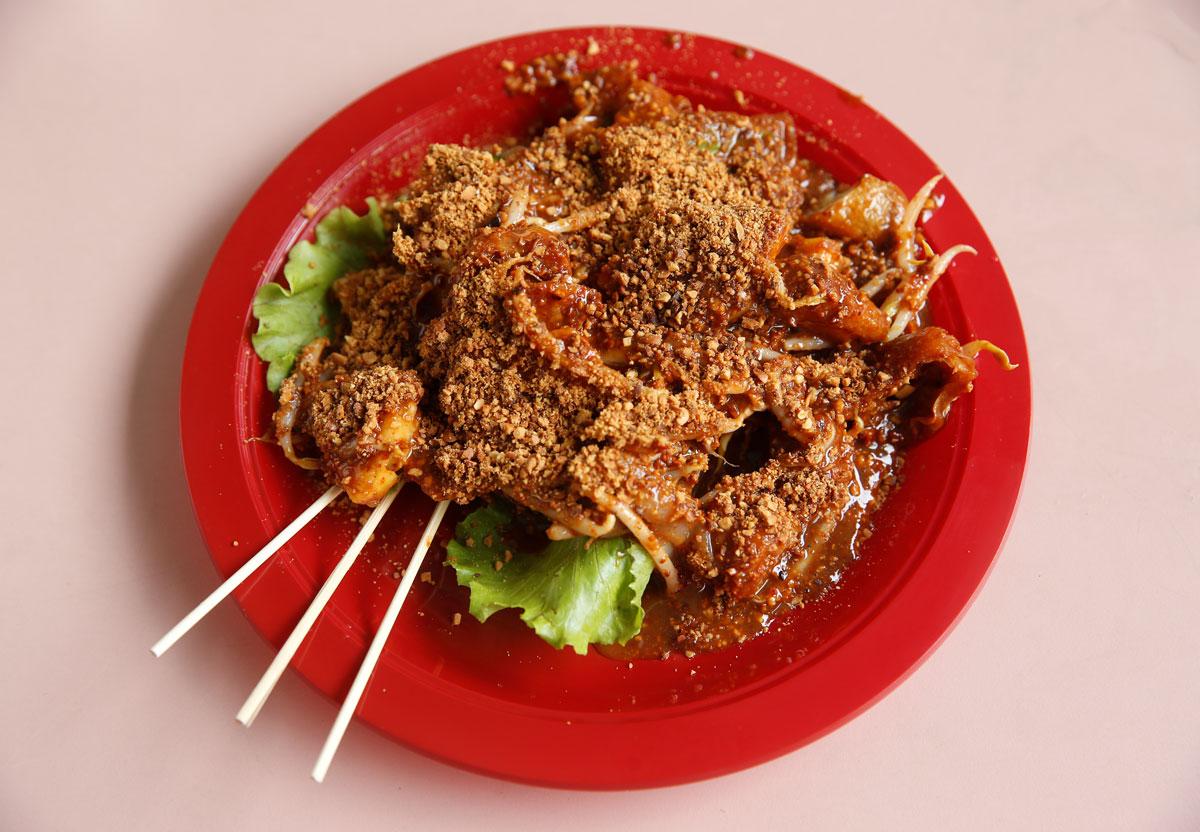 A plate of $3.70 rojak (fruit and vegetable salad).