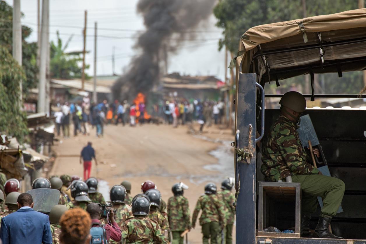 Anti-riot police approach demonstrators in the Kibera neighborhood of Nairobi, Kenya.
