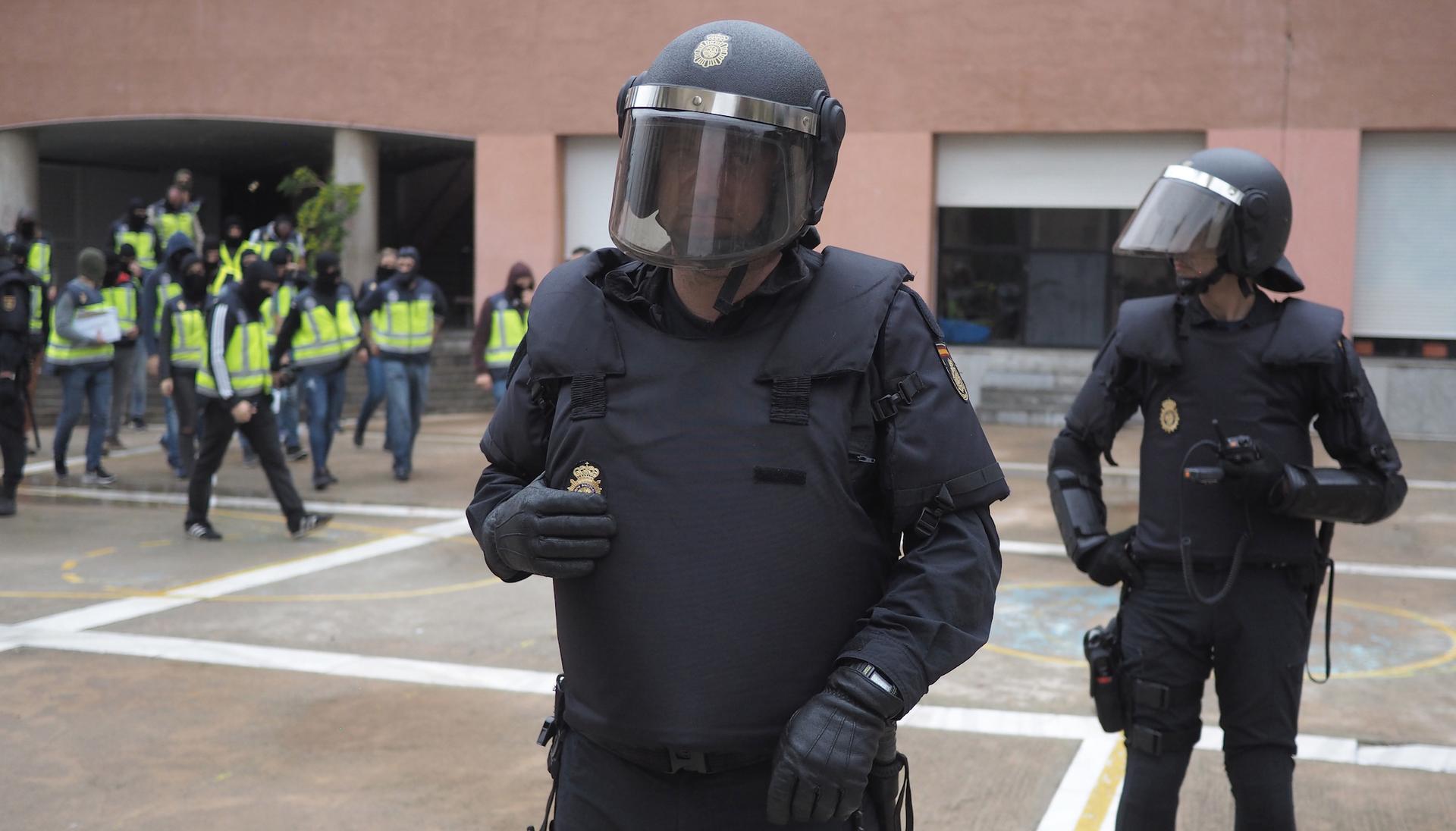 Spanish police arrive at a Barcelona school where Catalan independence voting was taking place.
