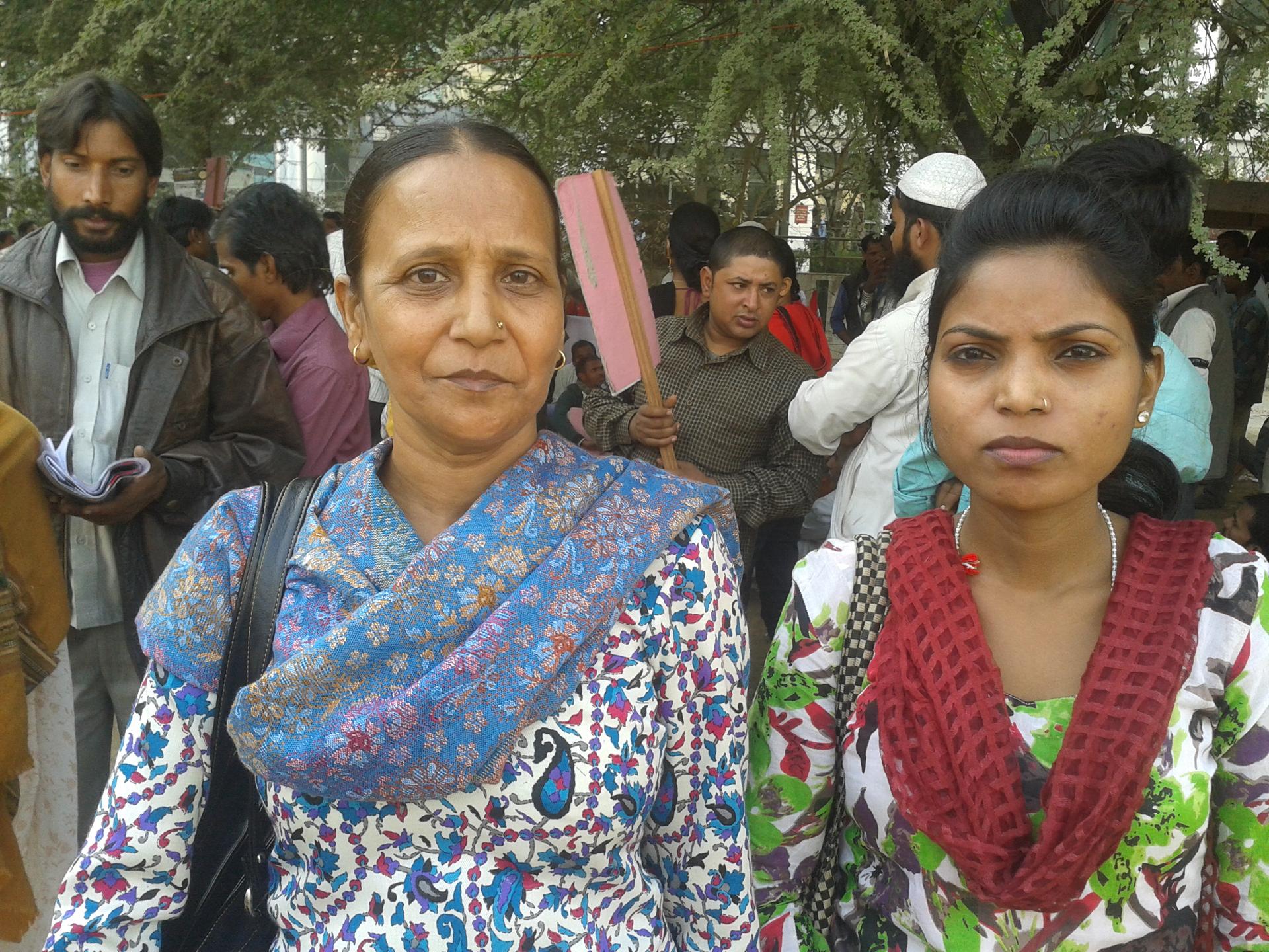 Sudha, a 42 year-old widow (left) has been selling purses at a market in West Delhi. Lately, she says her business has suffered as more and more people are choosing to shop at bigger stores in malls.