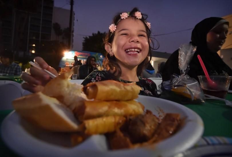 Yara Dalati, 5, of Anaheim smiles at her iftar meal