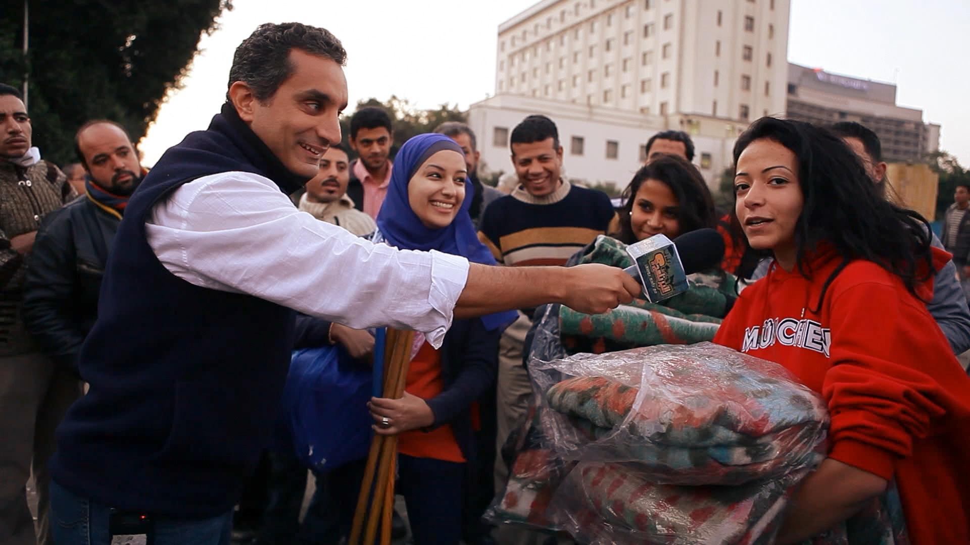 Bassem Youssef interviewing people on the streets of Cairo in the early days of his transition from a heart surgeon to a political satirist, November 2011.