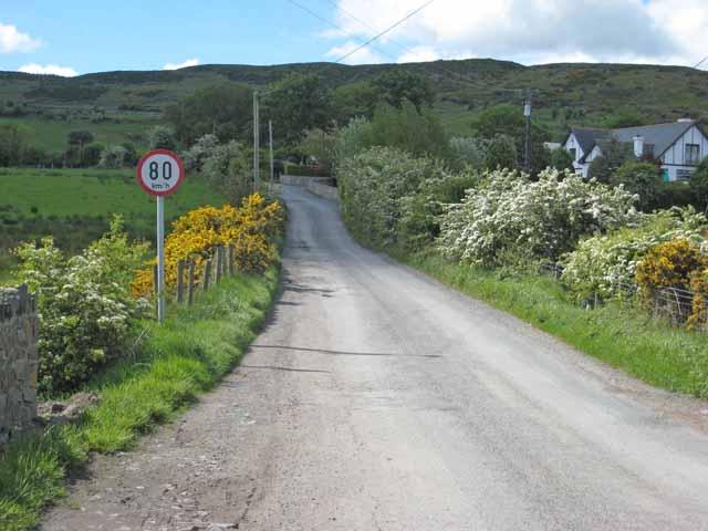 The border between the UK and the Republic of Ireland at Killeen is marked only by a road sign using the metric system.
