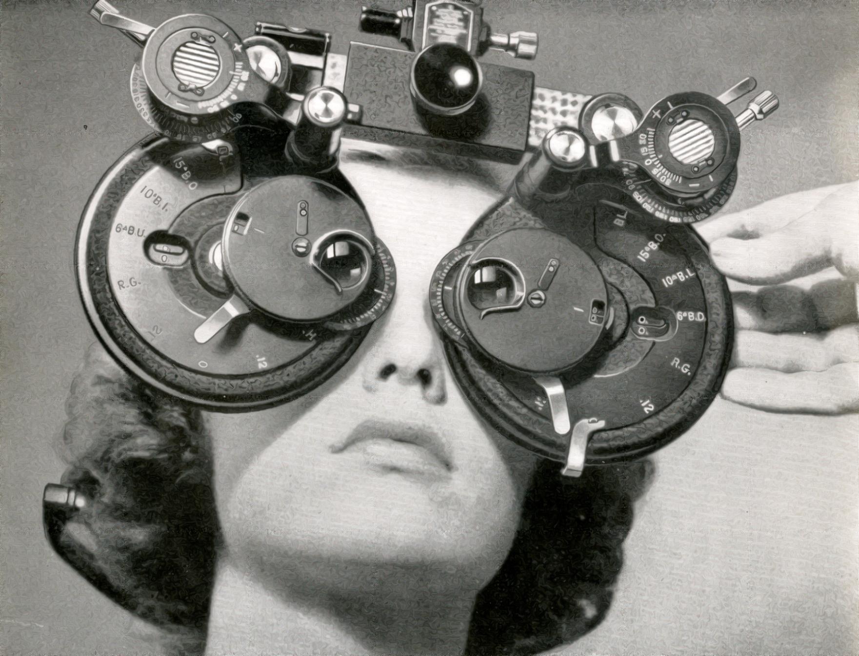 Woman looks through a phoropter in 1945. 