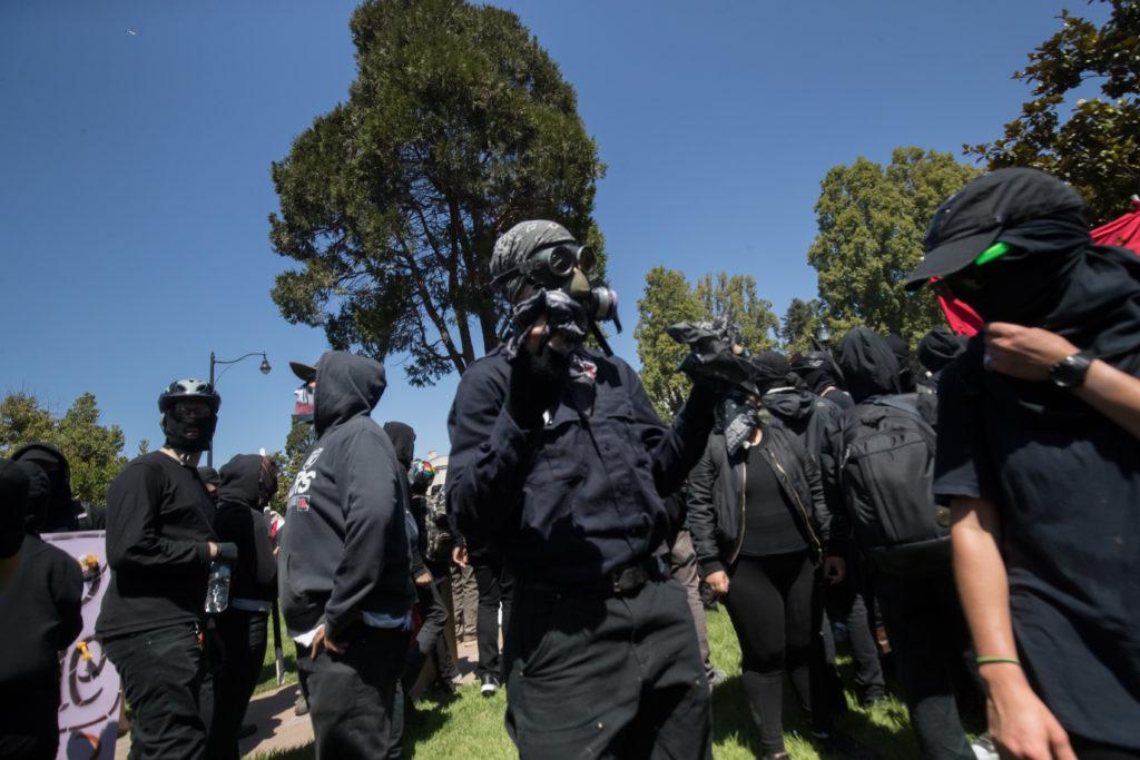 Members of the anti-fascist movement form a “black bloc” — moving in formation, wearing black — to protect the Aug. 27 march on a planned right-wing rally in downtown Berkeley, Calif.
