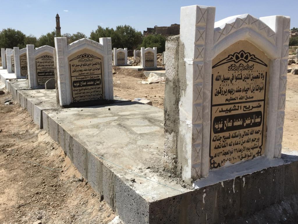 Twenty-six new graves outside the now-ruined home of the al-Sanabani family. All together 43 people died when an airstrike tore through a wedding party on Oct. 7.