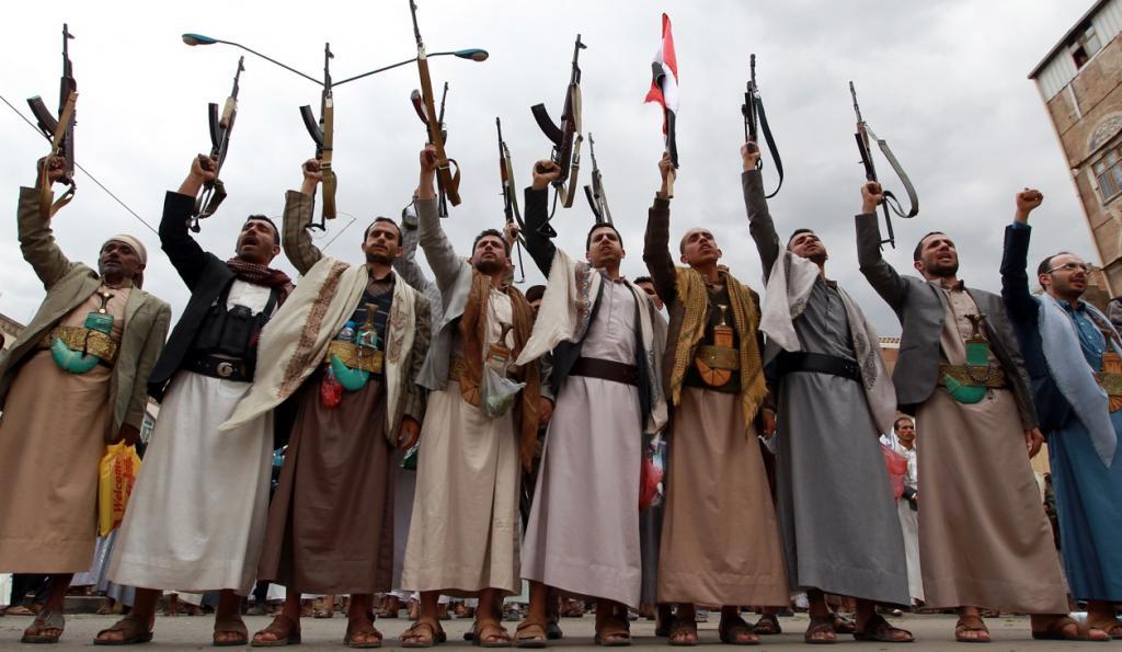 Houthi gunmen brandish their weapons on March 26 in Sanaa.