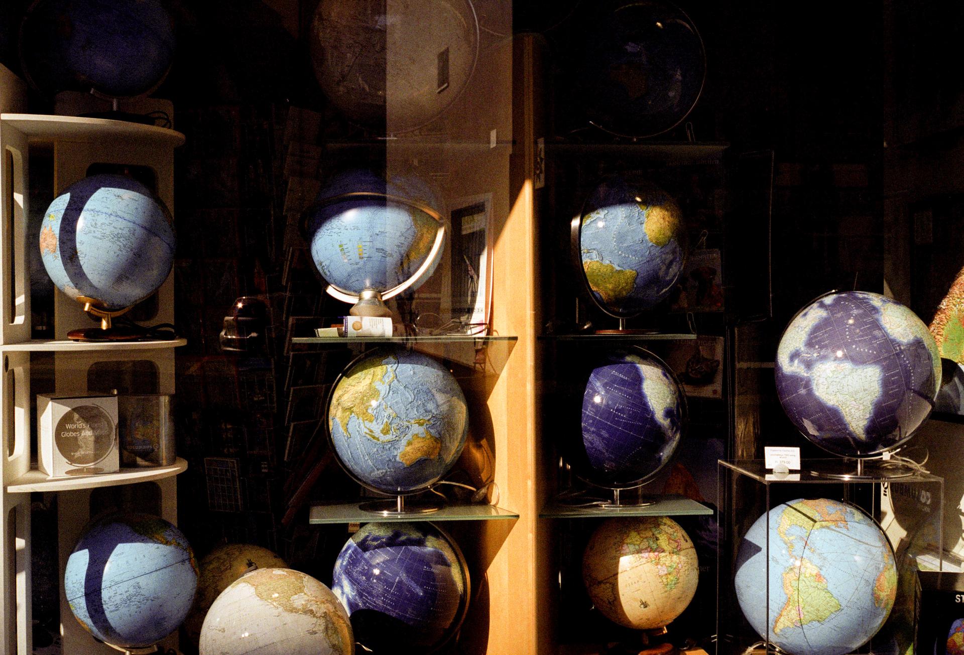 Globes in a shop window.