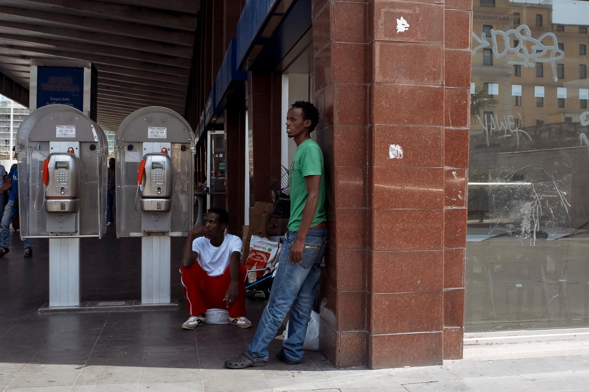 Young migrants hanging out in front of Rome's central train station. The station lies directly in between the squat houses of Abraham, a 25-year-old migrant from Eritrea, and Estella, a 25-year-old militant neo-Fascist.