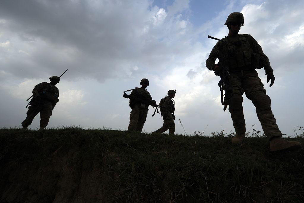 US soldiers from Viper Company (Bravo), 1-26 Infantry walk during a patrol at Combat Outpost (COP) Sabari in Khost province in the east of Afghanistan on June 22, 2011.