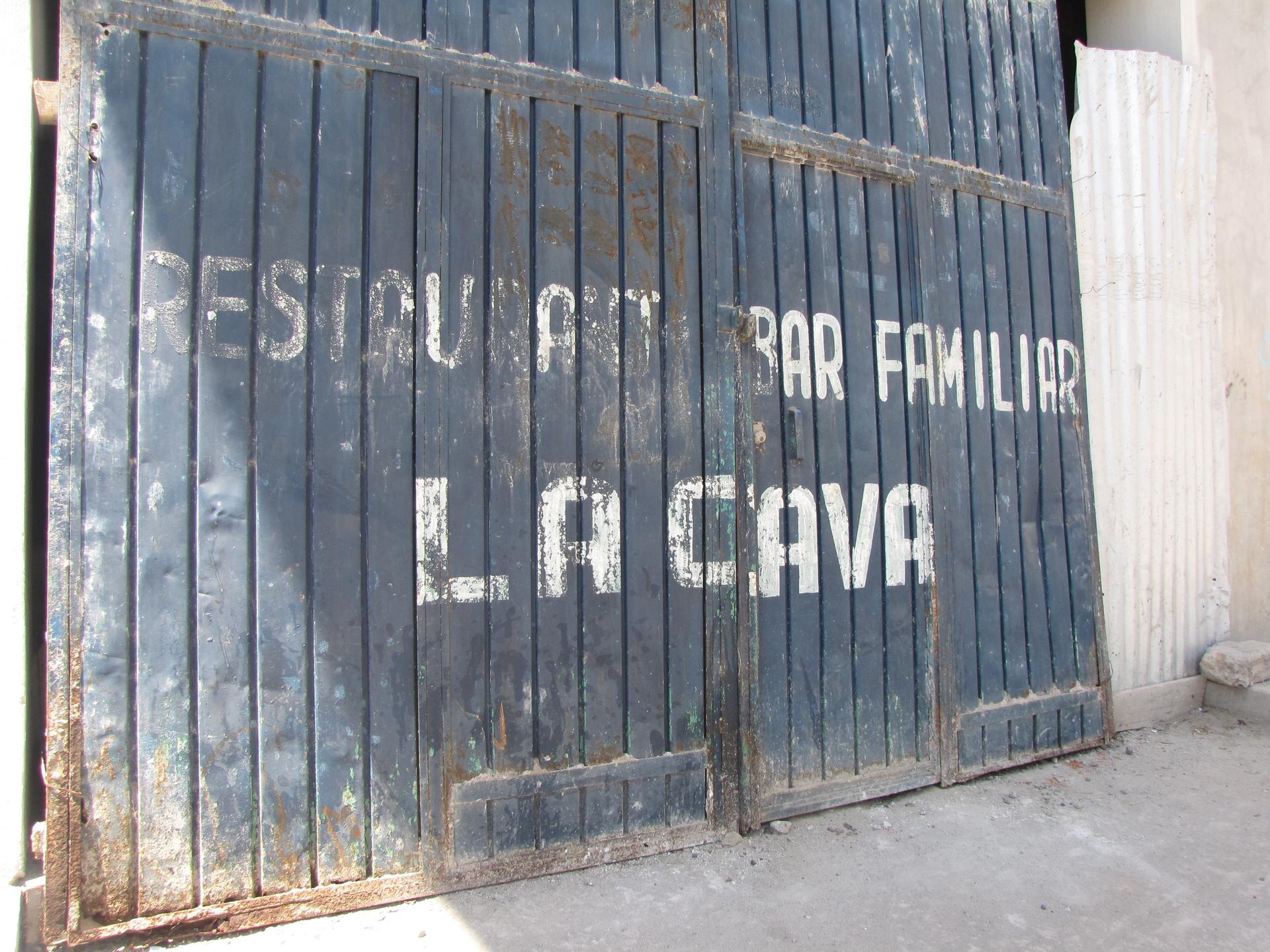 The outside door of the bar Mona worked in after arriving in Frontera Comalapa, Mexico.