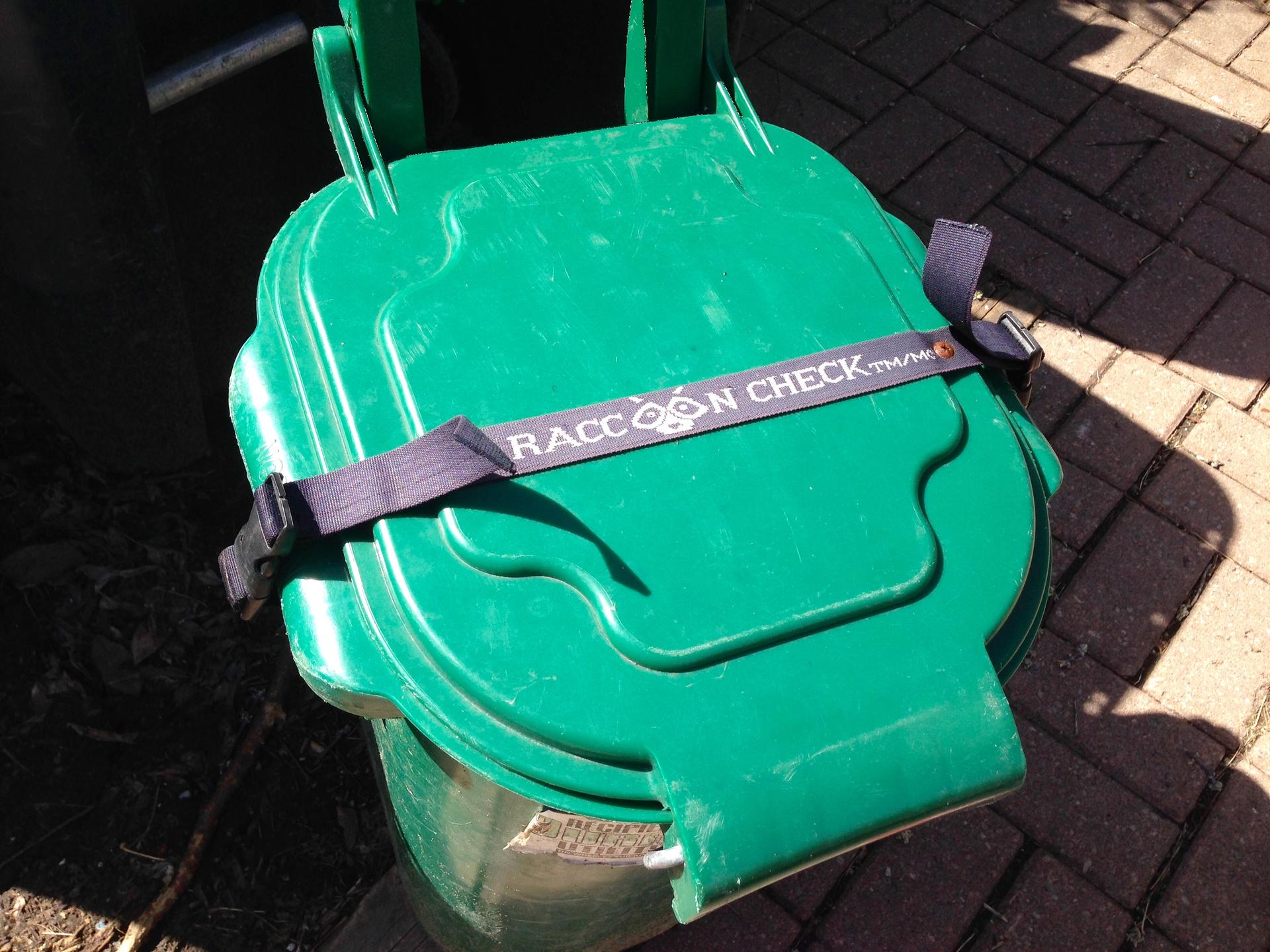 Raccoon lock on Bennett Mills' organic waste bin.