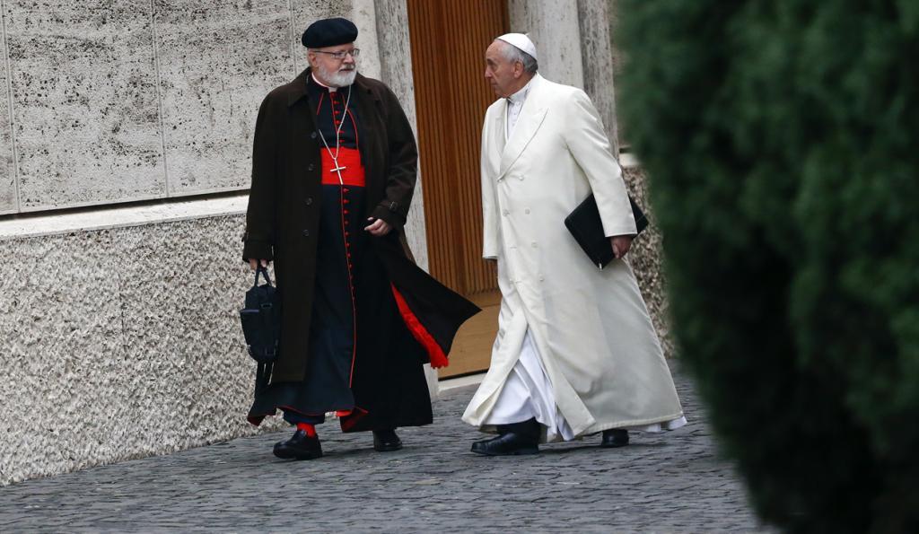 Pope Francis talks with Cardinal Sean Patrick O'Malley as they arrive at the Vatican on Feb. 13, 2015.