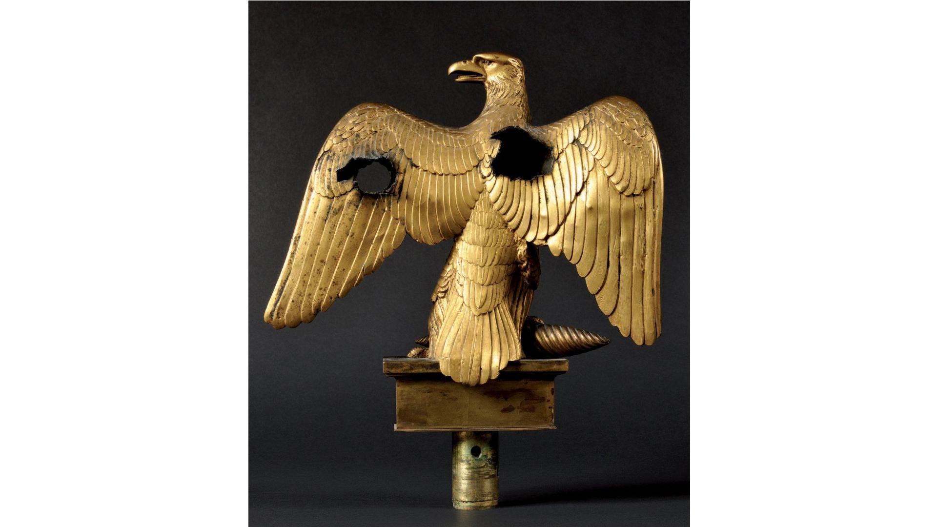 French Empire Injured flag eagle, 1804 model. Gilt bronze First Empire The eagle has been pierced by two case-shot bullets; sabre marks can also be seen on his head, and wing.
