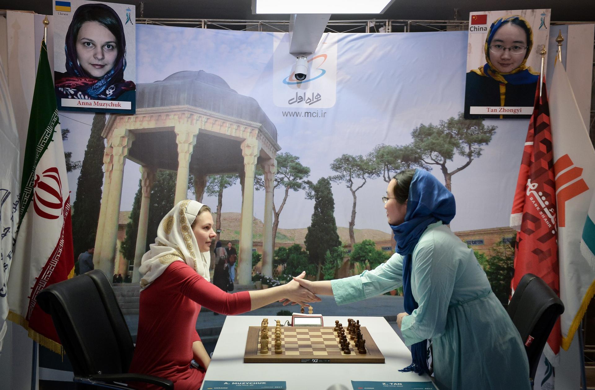 Anna Muzychuk shakes hands with Tan Zhongyi at the Women's World Chess Championship in Tehran, Iran on March 03, 2017.