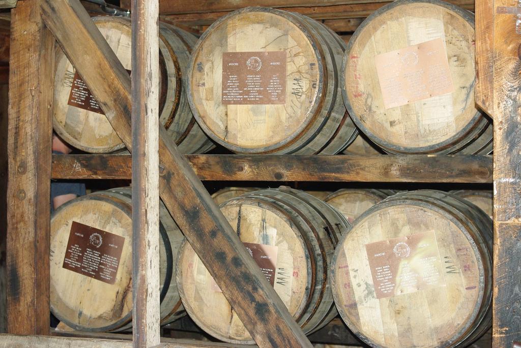Bourbon barrels age at the Maker's Mark Distillery. The aging process can vary greatly, depending on the desired taste of the end product.