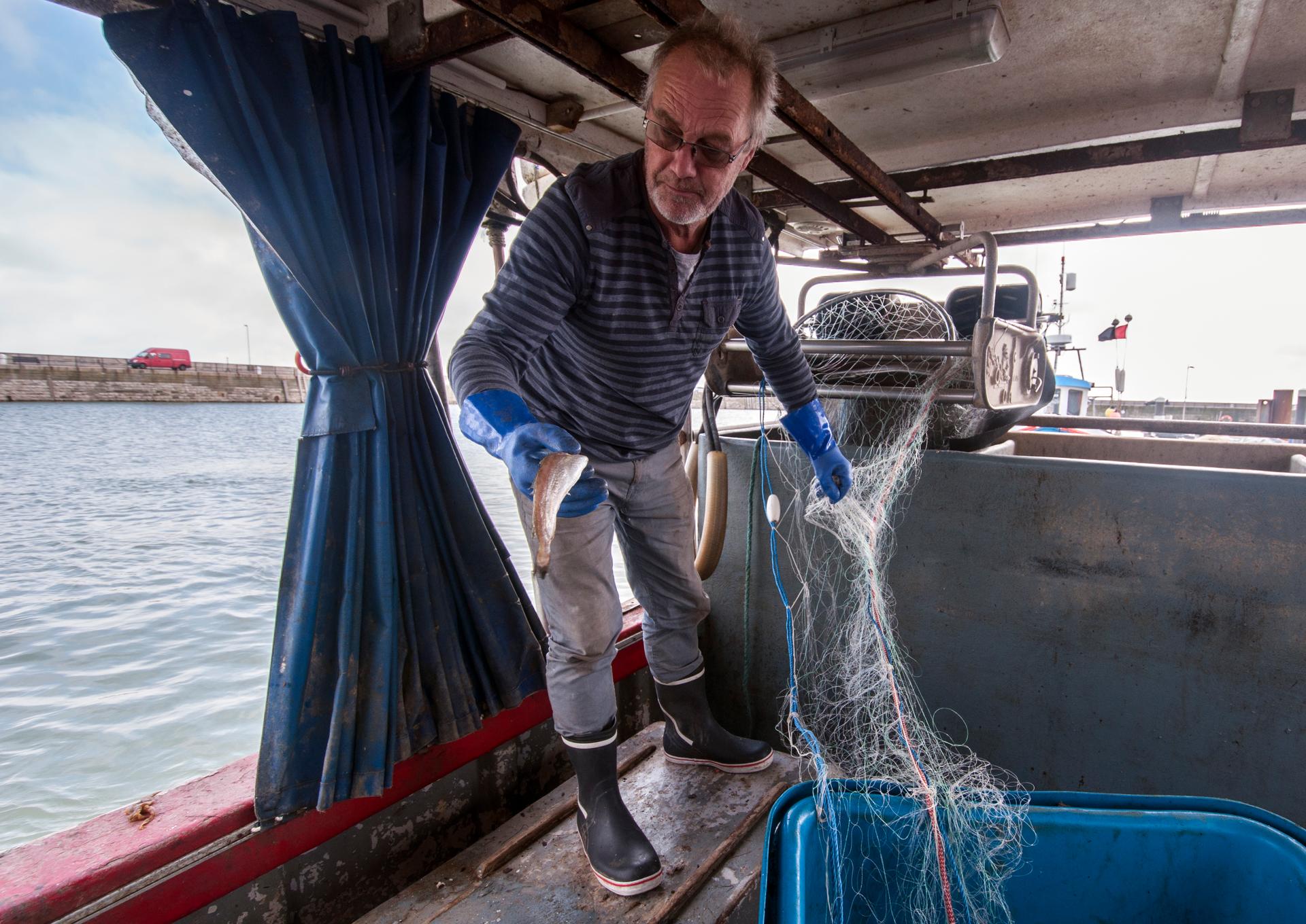 Fisherman Steve Barratt aboard his boat Razorbill in the Ramsgate harbor.
