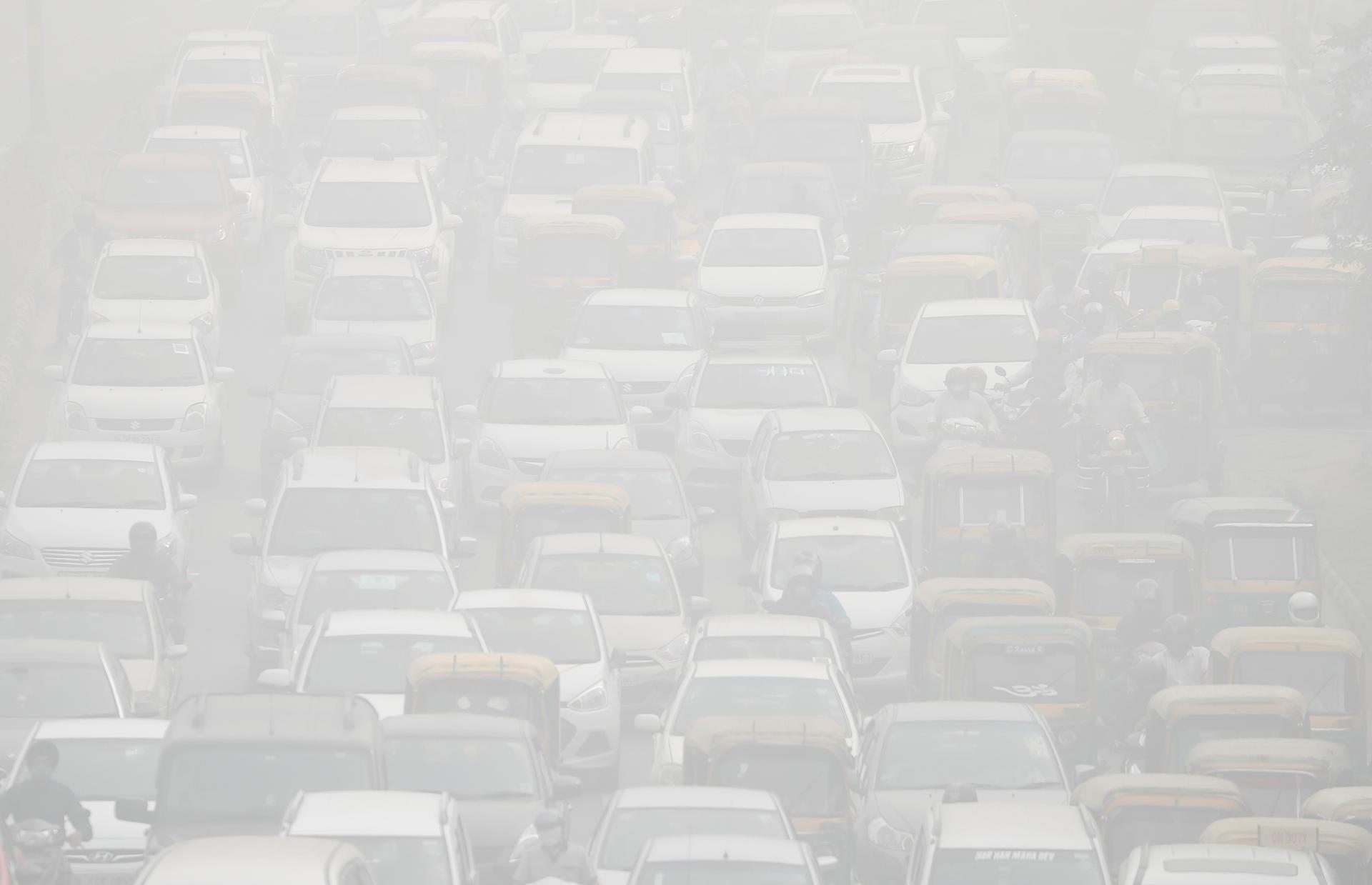 Vehicles drive through heavy smog in Delhi during the peak of the most recent pollution crisis, Nov. 8, 2017.