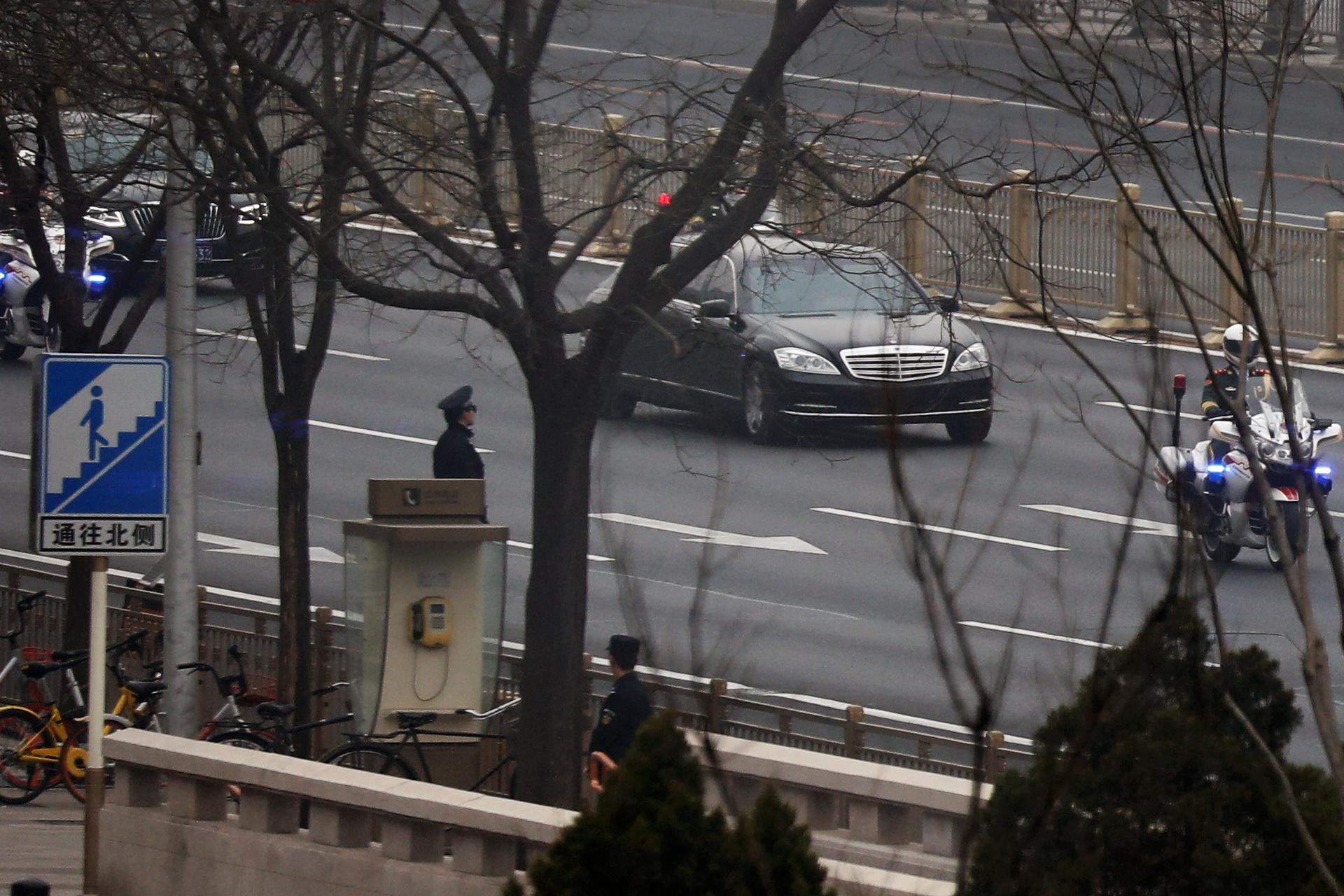 A motorcade believed to be carrying a North Korean delegation makes its way along Beijing's main east-west thoroughfare, Changan Avenue, in Beijing, China March 27, 2018.