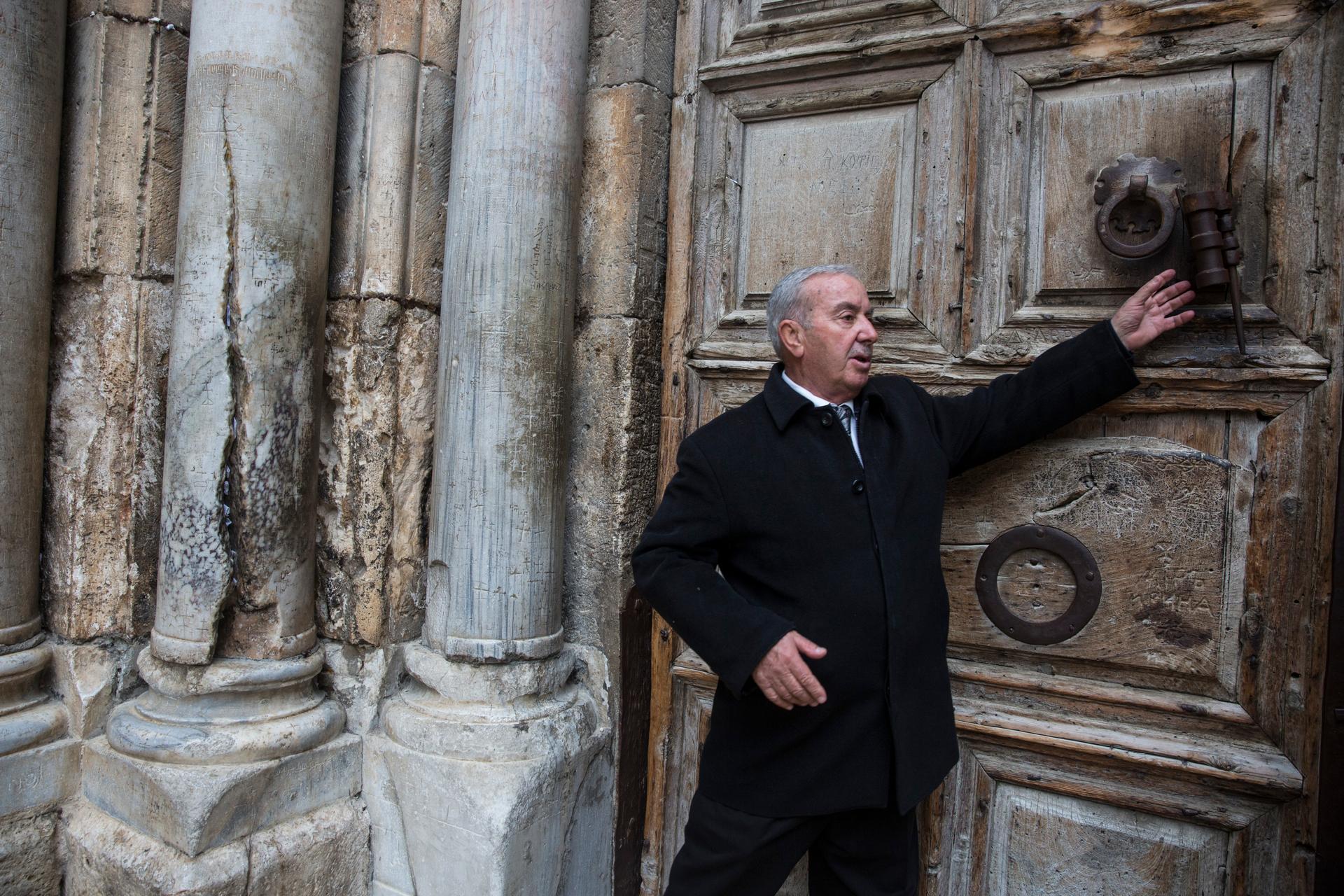 Mr. Wajeeh Nuseibeh outside one of the giant wooden doors of the Church of the Holy Sepulchre on Good Friday,
