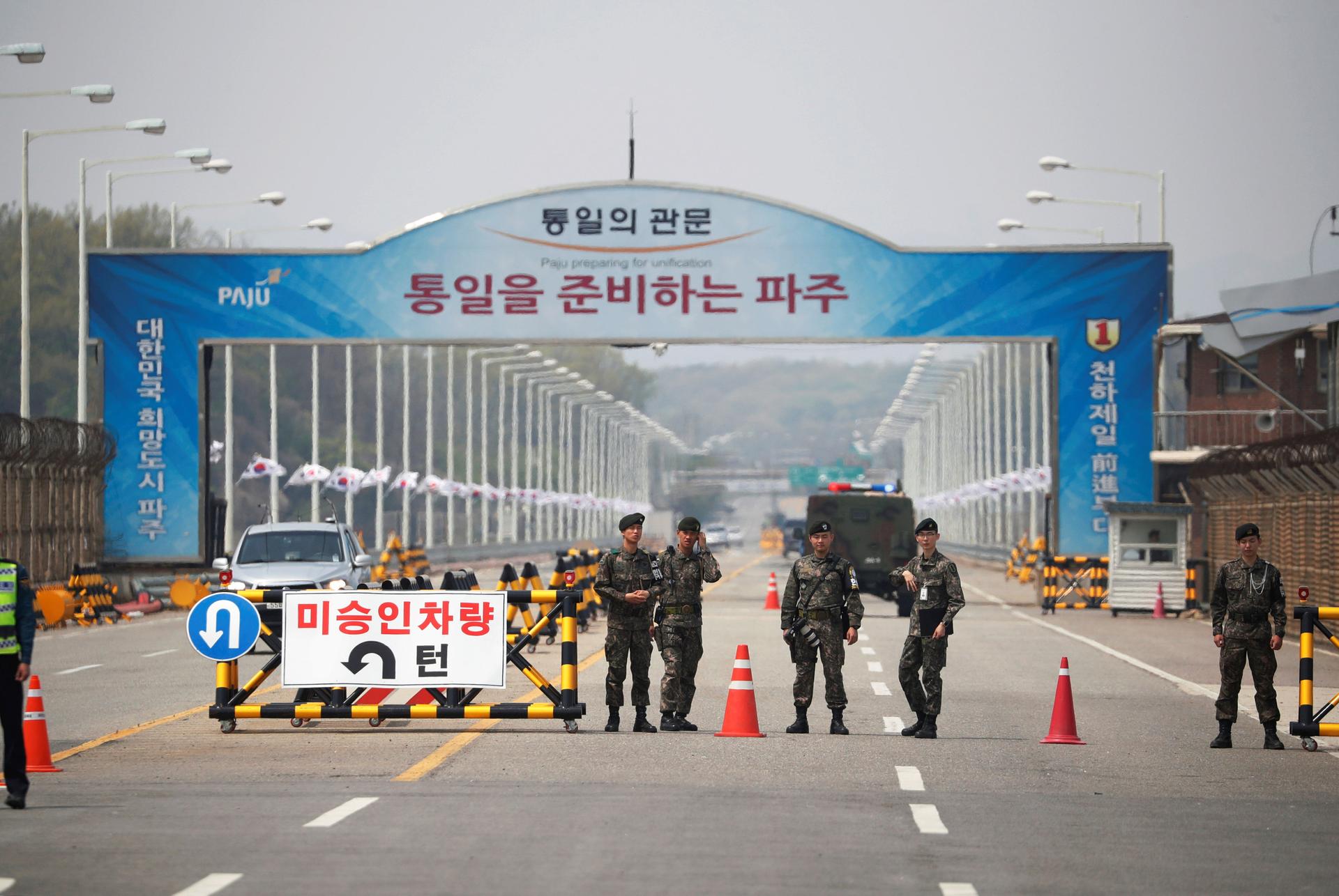 South Korean soldiers stand guard at a checkpoint