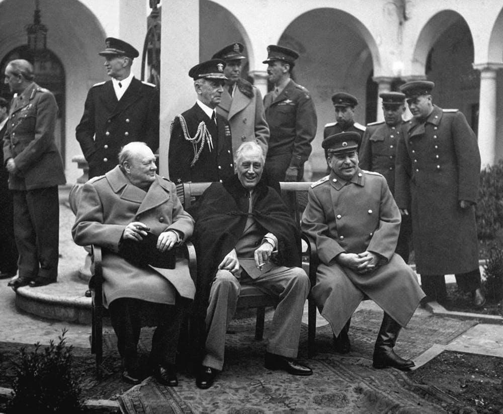British Prime Minister Winston Churchill, US President Franklin Roosevelt, and Soviet leader Joseph Stalin pose for a photo together at their meeting at Yalta in February 1945, where they agreed to veto power by the ‘big five.’